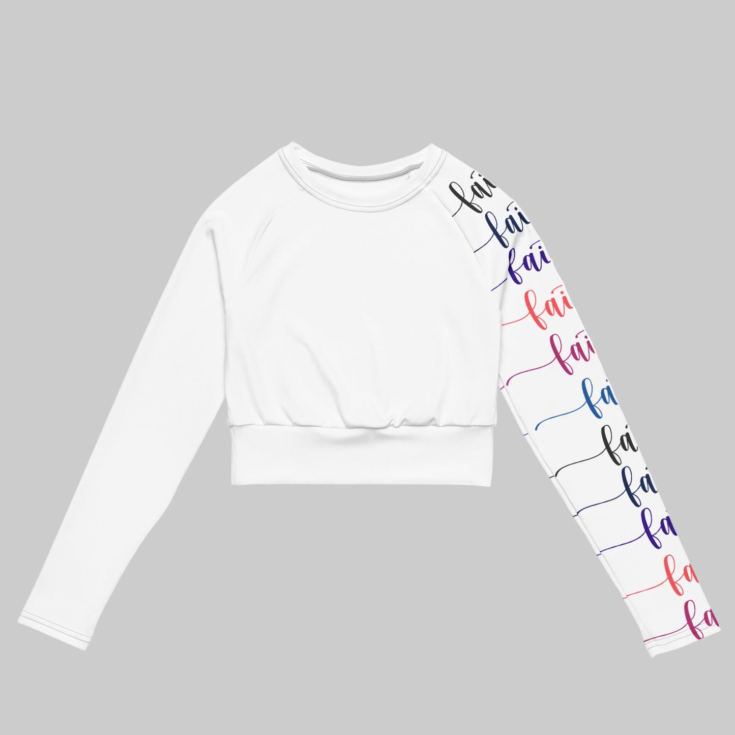 White long-sleeve crop top with 'fa la la' text design on sleeves against a white background