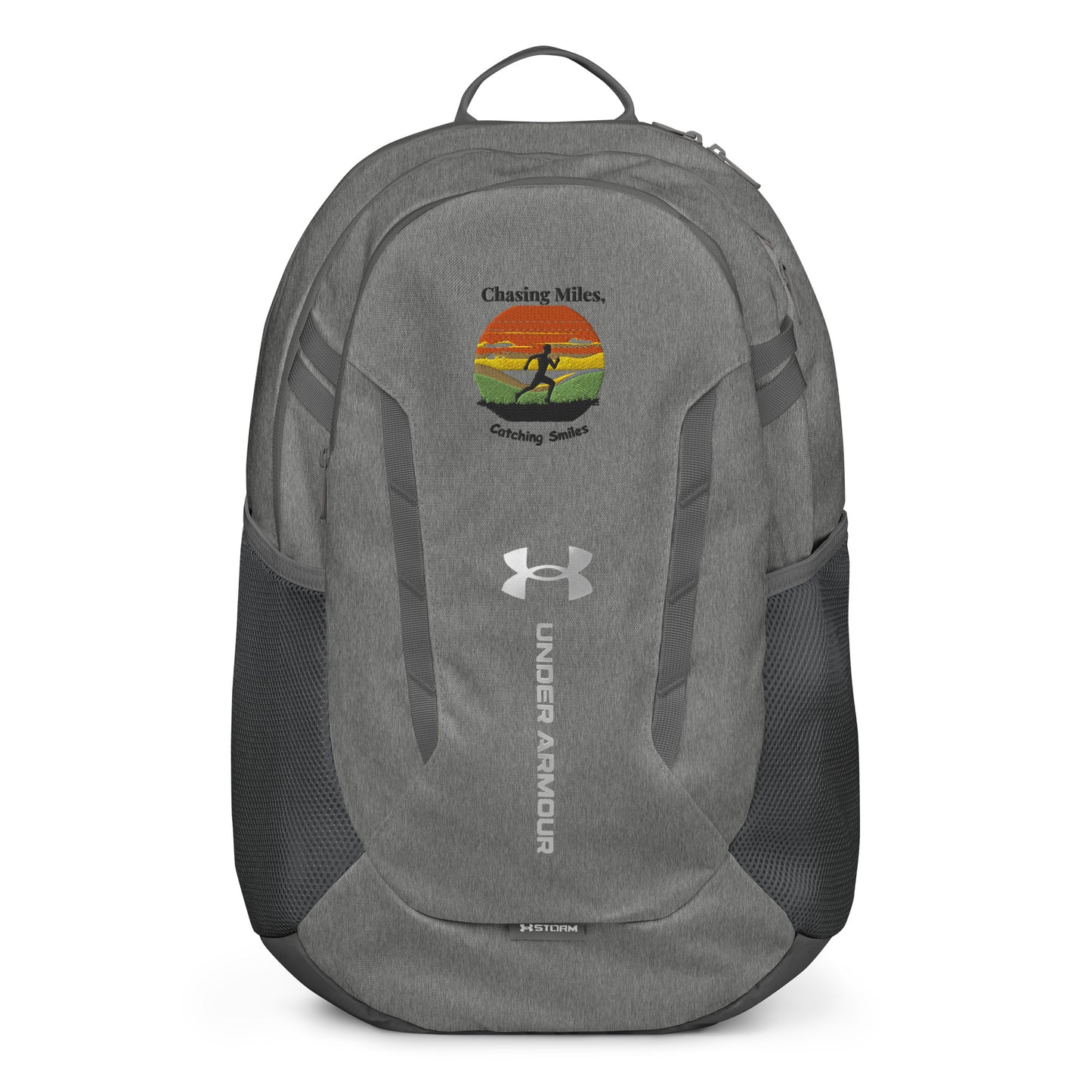 Gray Under Armour backpack with a graphic design on a white background