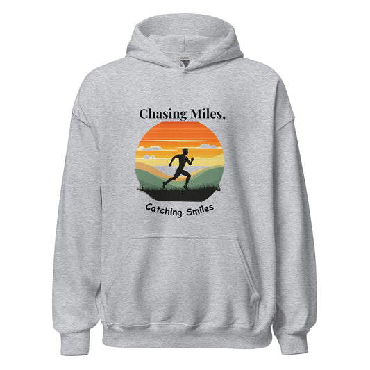 Gray hoodie with a graphic of a runner and sunset design on a white background