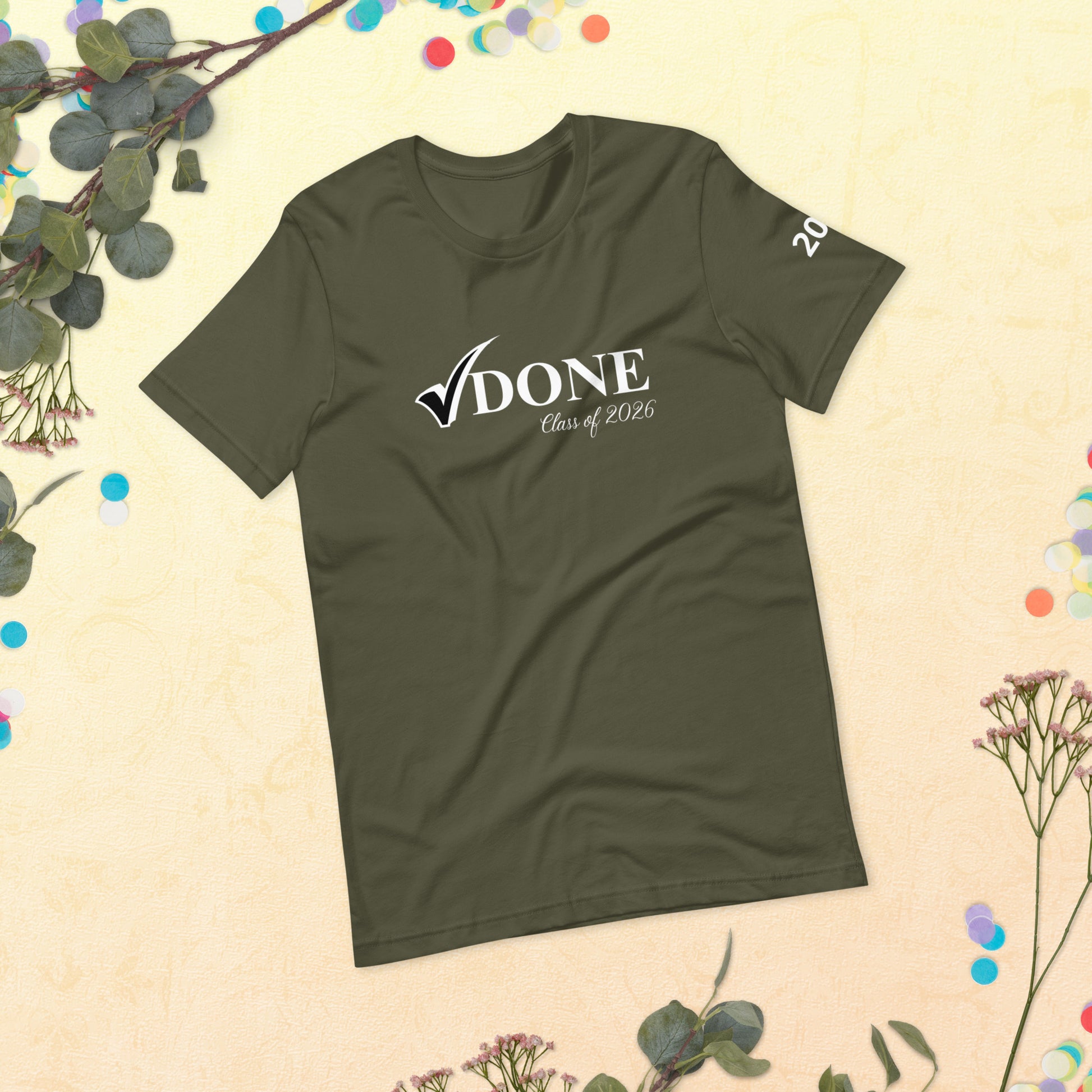 Green t-shirt with 'DONE Class of 2026' text on a beige background with decorative elements.