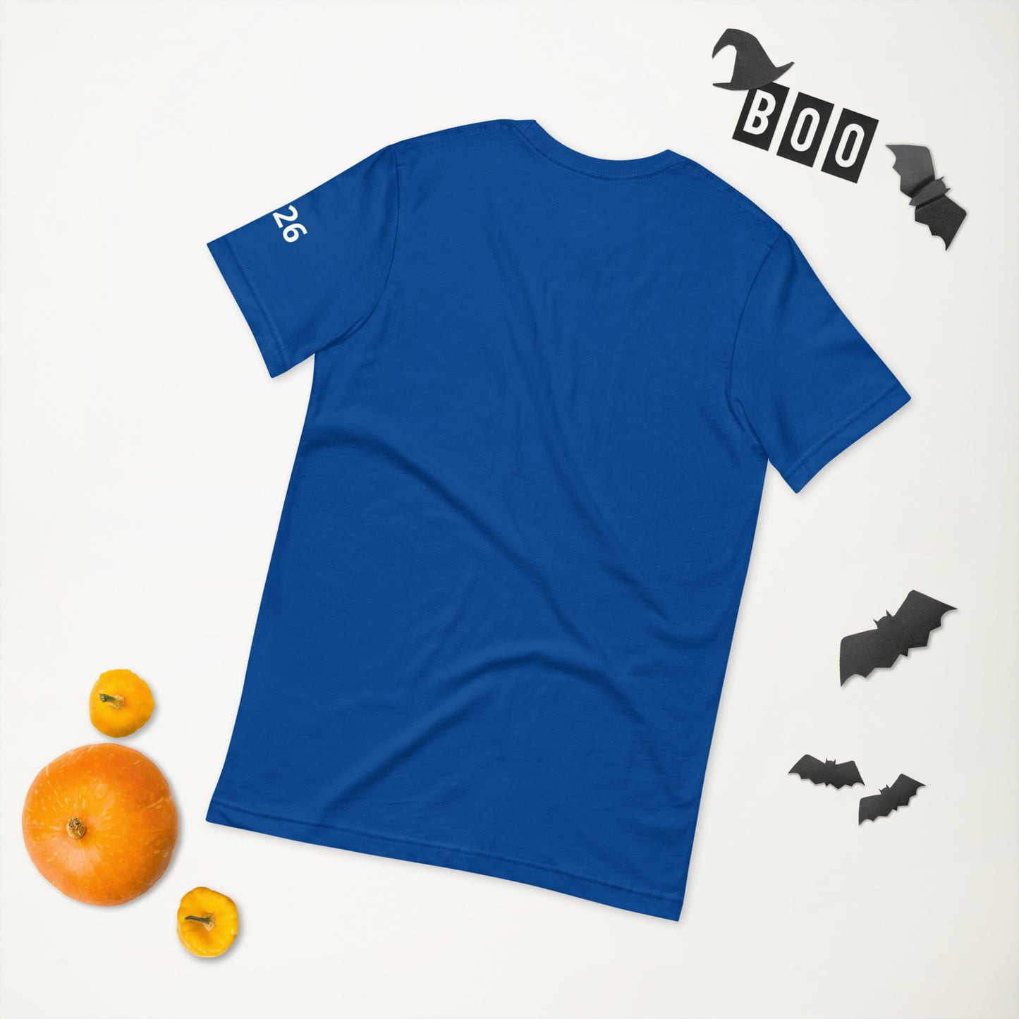 Blue t-shirt with 'BOO' text on a white background with Halloween decorations.