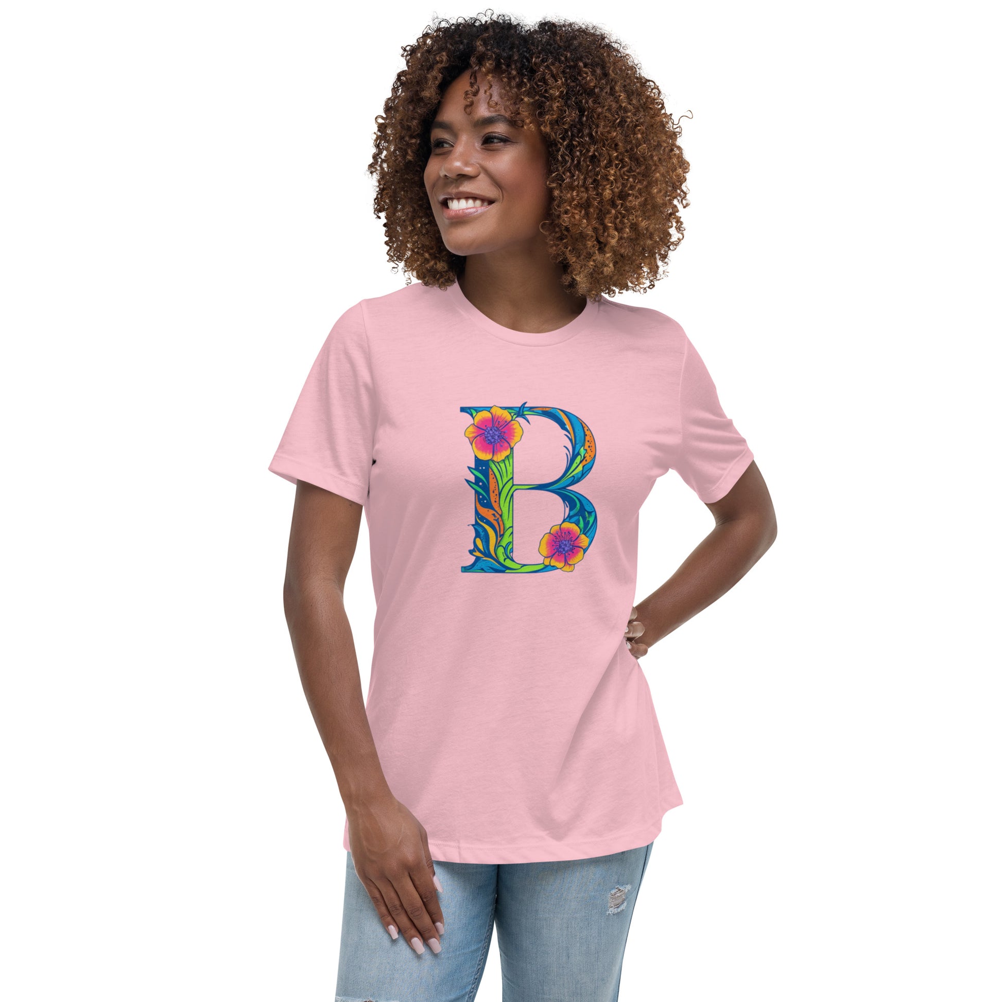 Woman wearing a pink t-shirt with a colorful 'B' design on a white background